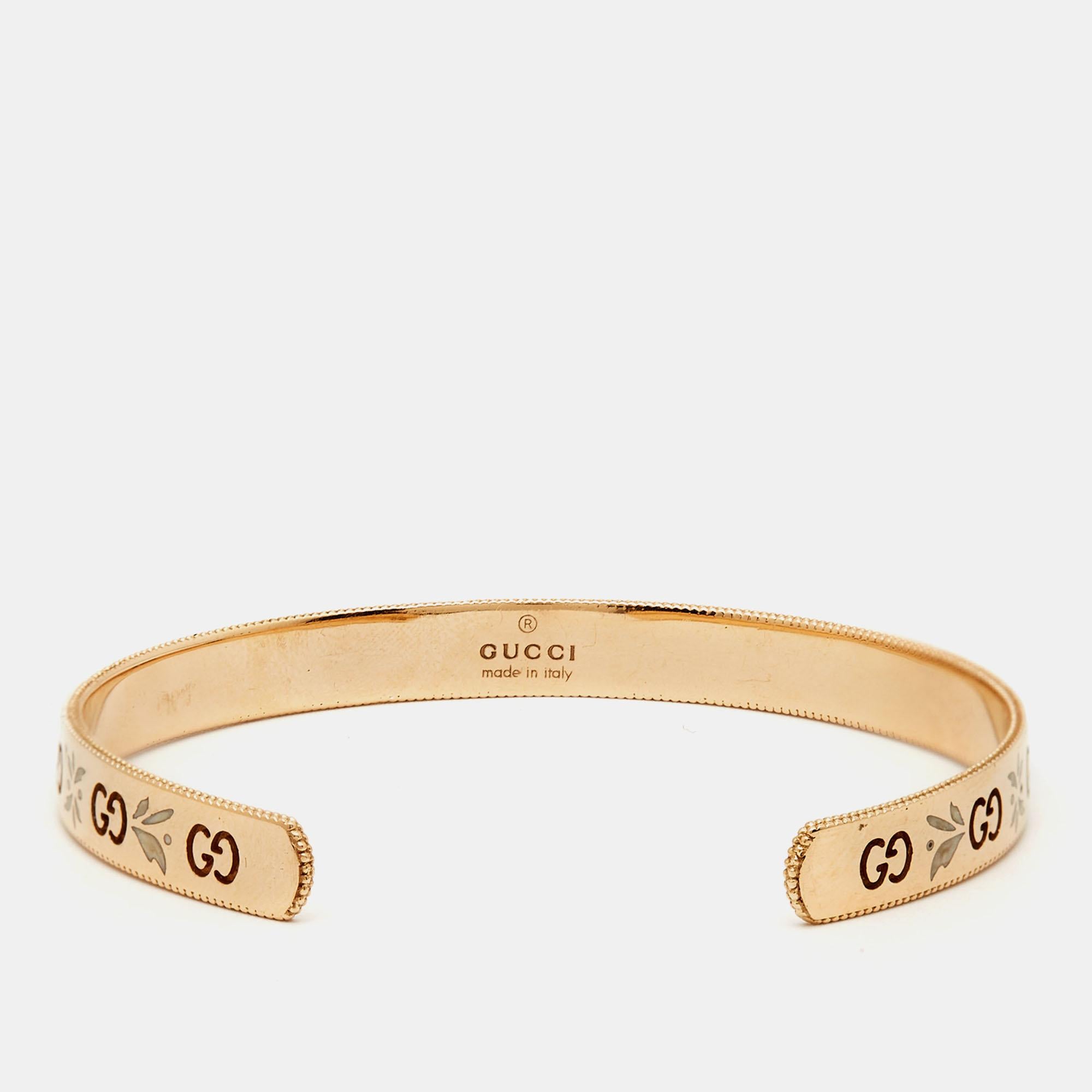 Embrace the timeless allure of the Gucci bracelet. Crafted with meticulous attention to detail, this exquisite piece combines luxurious 18k rose gold with delicate enamel blooms and GG logos, creating a captivating harmony of elegance and modernity.