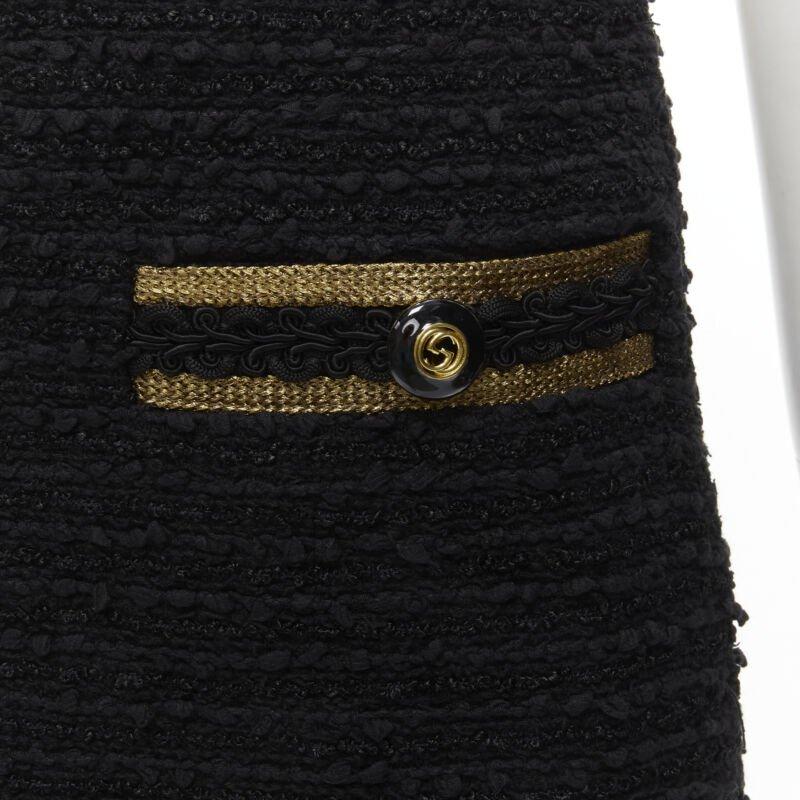 GUCCI GG logo button gold trim black tweed mini A-line skirt IT38 XS
Reference: AAWC/A00374
Brand: Gucci
Designer: Alessandro Michele
Material: Cotton, Blend
Color: Black, Gold
Pattern: Solid
Closure: Zip
Lining:  Silk
Extra Details: GG logo