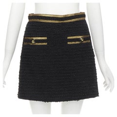 GUCCI - Mini jupe trapèze en tweed noir avec boutons dorés et logo GG, taille IT 38 XS