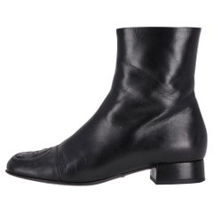 Gucci GG Logo Embossed Leather Ankle Boots