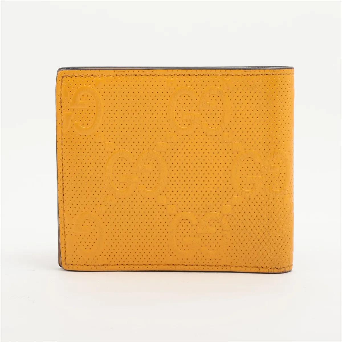 Portafoglio compatto in pelle goffrata GG di Gucci Giallo In condizioni buone in vendita a Indianapolis, IN