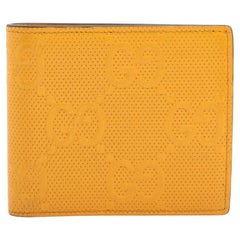 Gucci GG Logo Embossed Leather Compact Wallet Yellow
