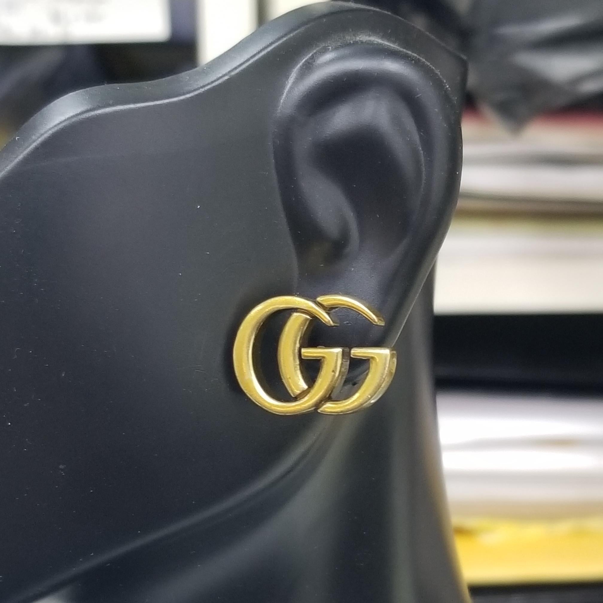 gucci logo earrings gold