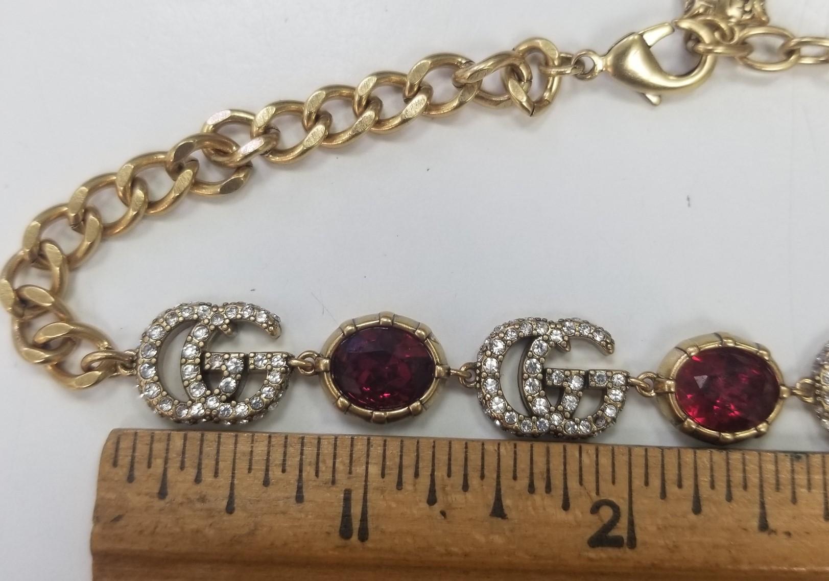  A red faceted crystal pendant combines with the crystal Double G detail, forming a sparkling pendant that completes these earrings in aged gold-toned metal 16 inches.

    Metal with aged gold finish
    Crystal encrusted Double G detail
    Red