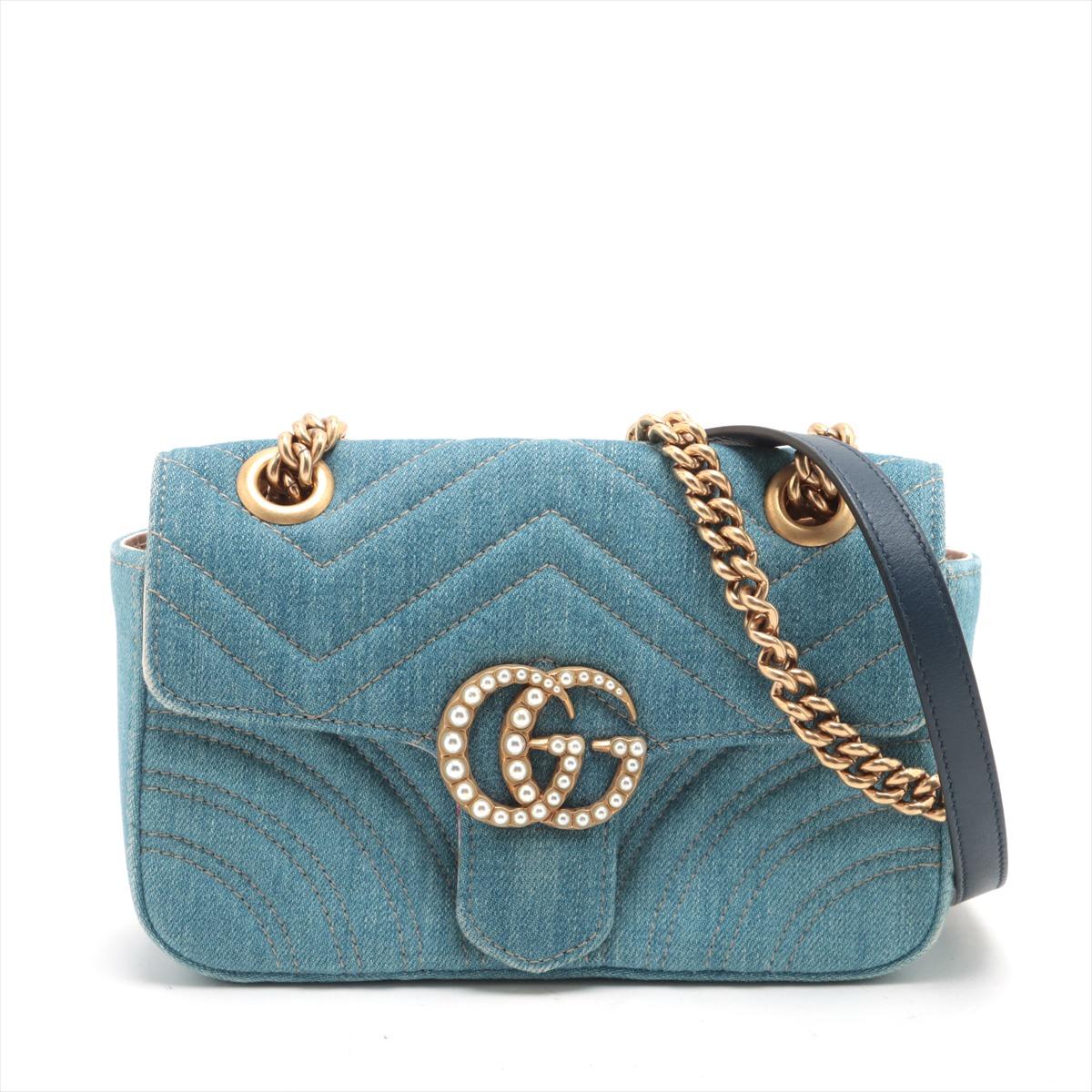 *will ship about 1/25

The Gucci Limited Edition Chevron Denim Pearl Chain Shoulder Bag in Blue is a striking blend of modern design and luxurious detailing. Crafted from high-quality denim, the bag features a chevron pattern that gives it a