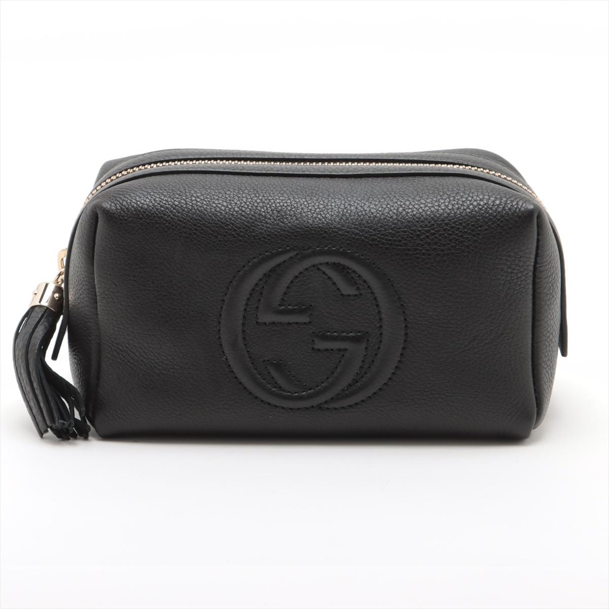 The Gucci GG Logo Soho Leather Pouch in Black is a sleek and sophisticated accessory, perfect for elevating any ensemble. Crafted from soft, pebbled leather, the pouch features the iconic interlocking GG logo embossed on the front, adding a touch of