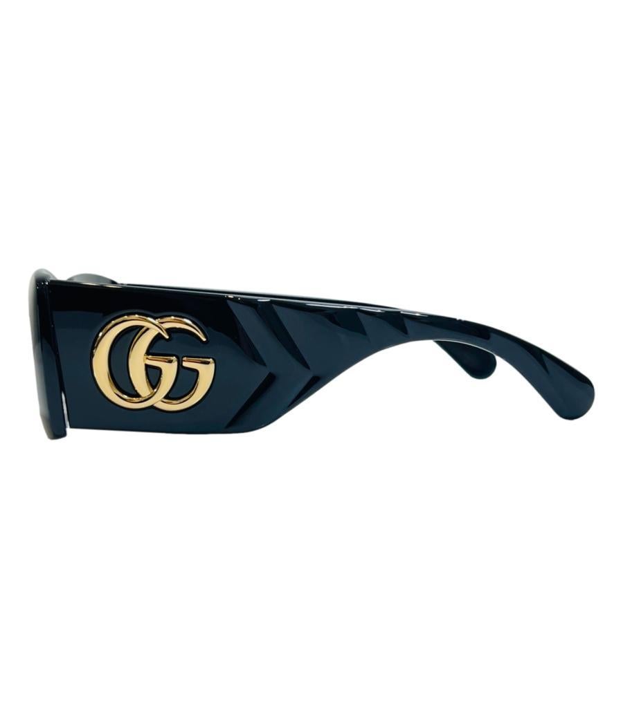 Gucci 'GG' Logo Sunglasses
Black rectangular sunglasses designed with signature gold double G on each side.
Featuring grey lenses and wide quilted arms detail. Rrp Approx. £300
Size –  One Size
Condition – Very Good
Composition – Acetate
Comes with