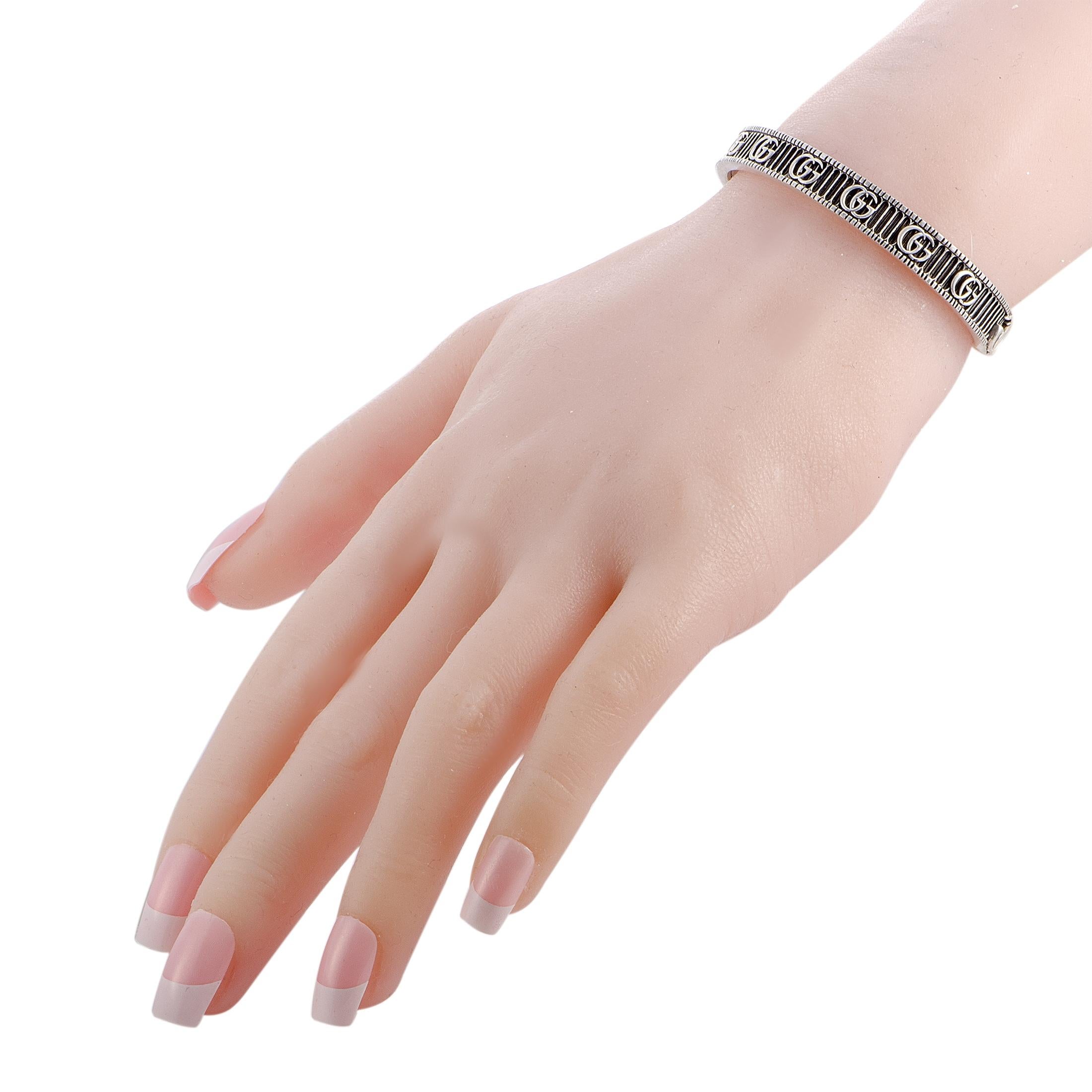 The Gucci “GG Marmont” bracelet is crafted from aged sterling silver and weighs 23 grams, measuring 7” in length and 2.25” in diameter.
 
 The bracelet is offered in brand new condition and includes the manufacturer’s box and papers.
