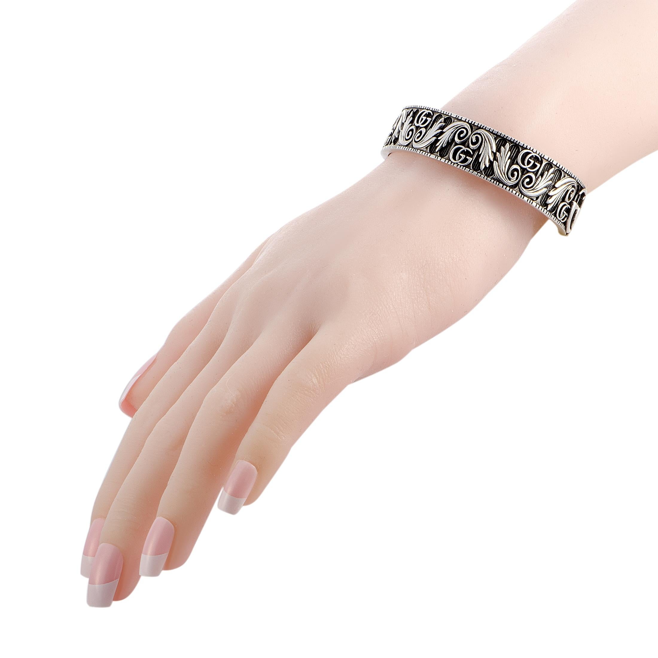 The Gucci “GG Marmont” bracelet is crafted from aged sterling silver and weighs 47 grams, measuring 7.85” in length and 2.50” in diameter.
 
 The bracelet is offered in brand new condition.
