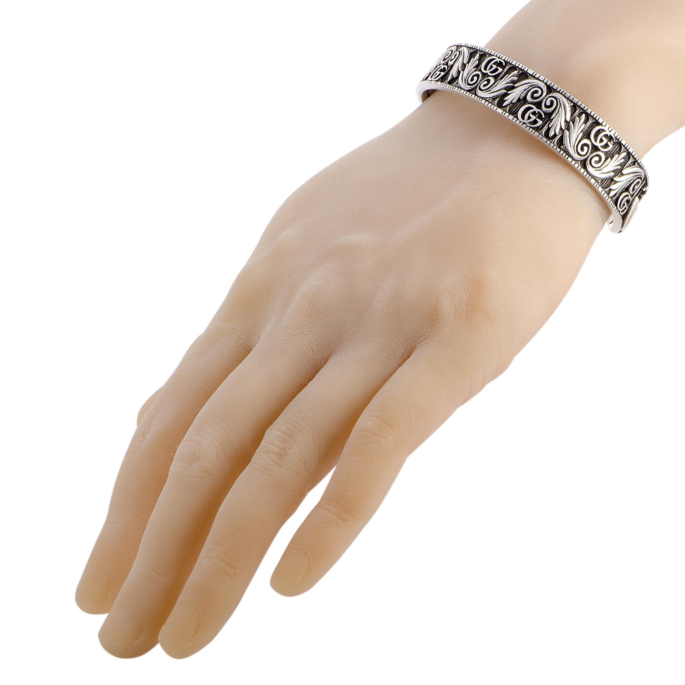 The Gucci “GG Marmont” bracelet is crafted from aged sterling silver and weighs 56 grams, measuring 8.30” in length and 2.65” in diameter.
 
 The bracelet is offered in brand new condition.
