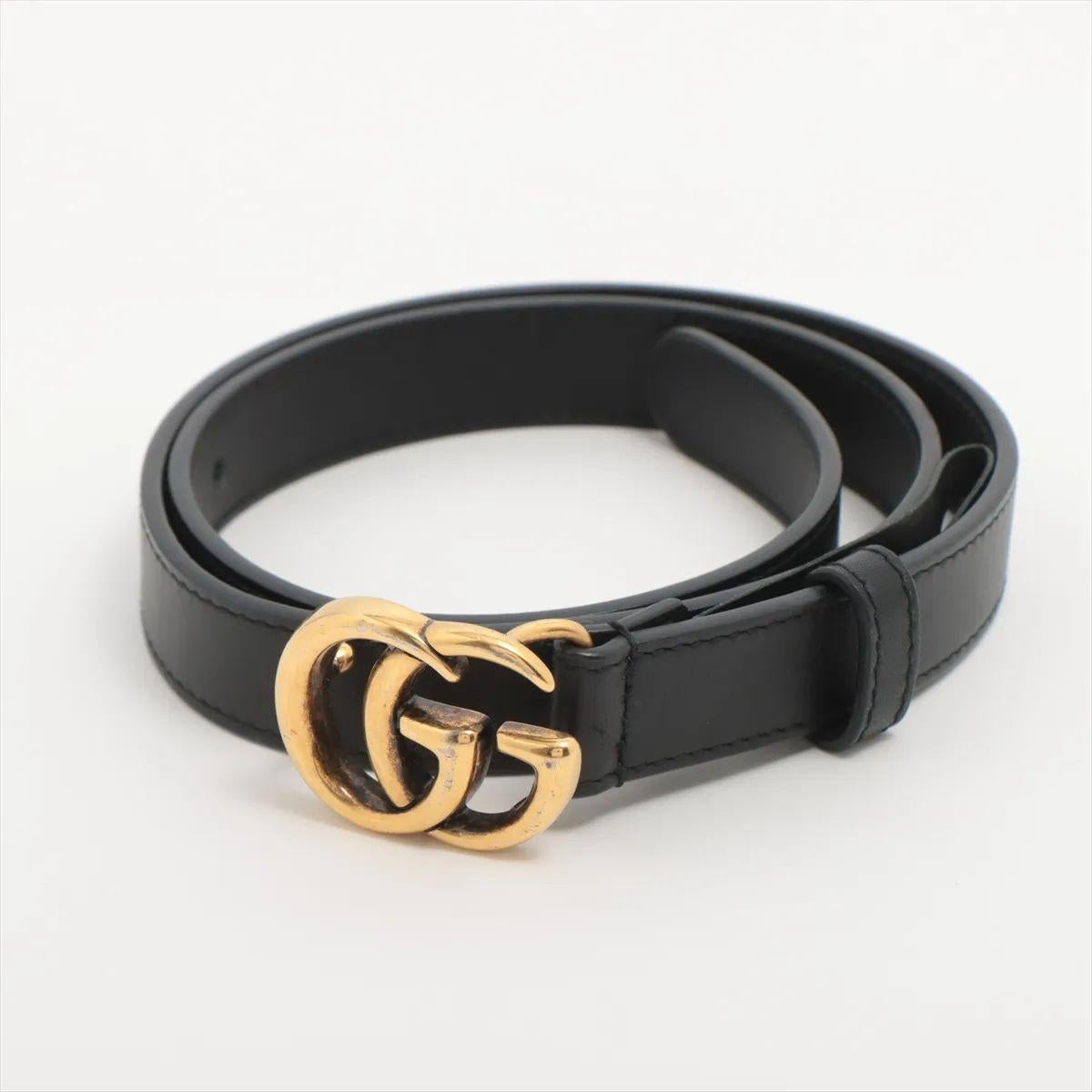The Gucci GG Marmont Belt in Black is a sleek and sophisticated accessory that effortlessly combines style and versatility. Crafted from smooth leather, the belt features an iconic GG Marmont logo buckle in an antique gold-tone finish, adding a