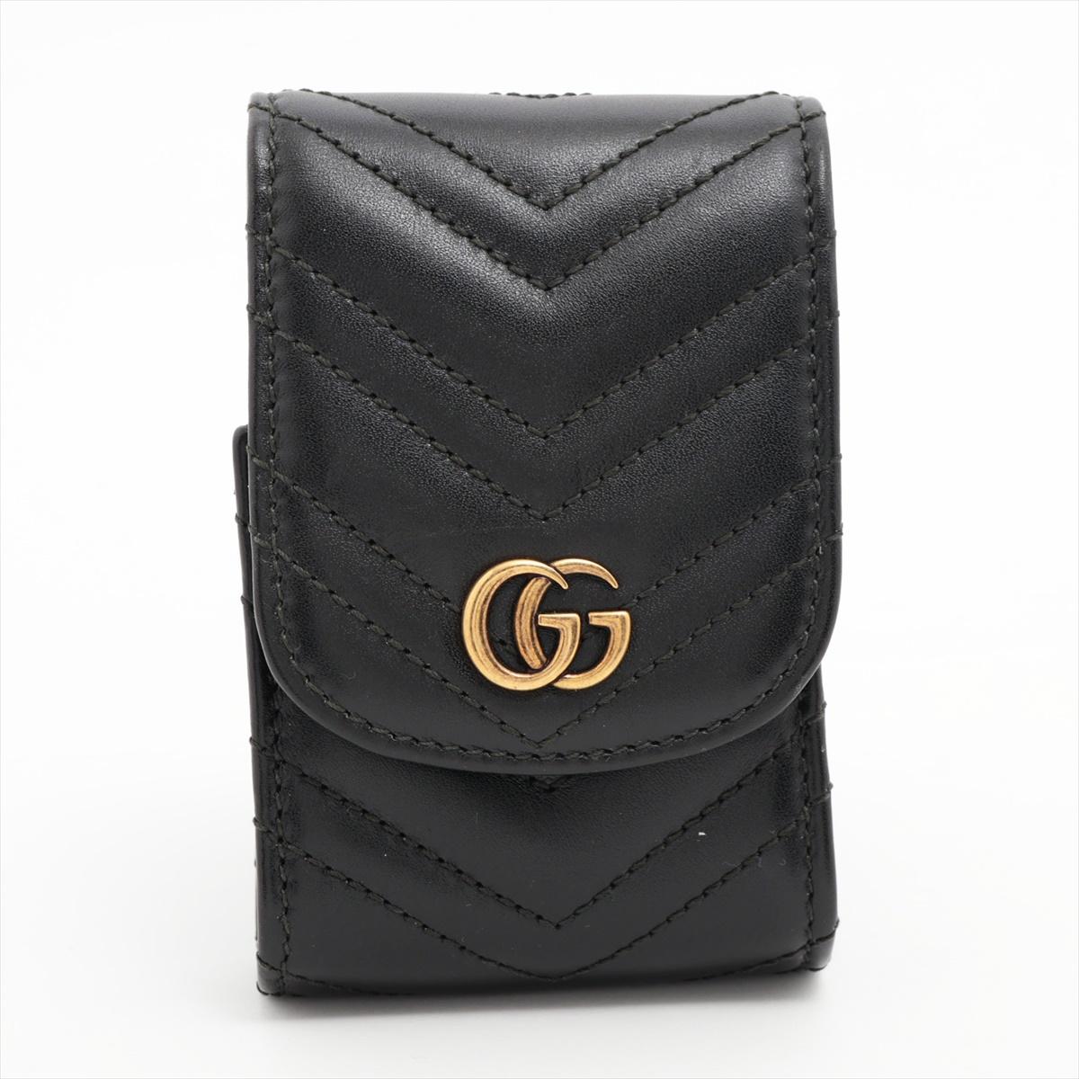The Gucci GG Marmont Cigarette Case in Black is a sleek and stylish accessory that merges luxury and practicality. Crafted with meticulous attention to detail, the case features Gucci's iconic GG Marmont quilted pattern, adding a touch of