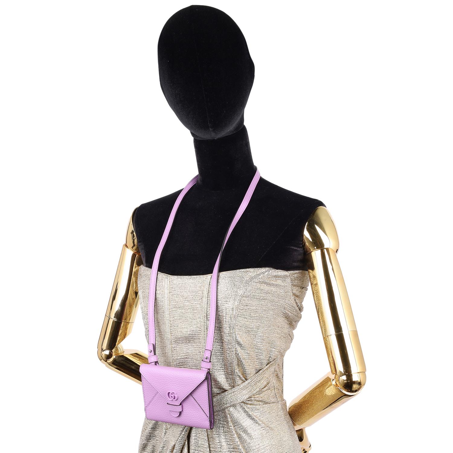 Authentic Gucci GG Marmont Envelope Card Case Shoulder Bag in Purple. Features GG logo, front flap closure, purple leather, silver hardware, interior lining with zipper slip pocket and 5 cc patch pockets, long leather strap that is removable. 

Use