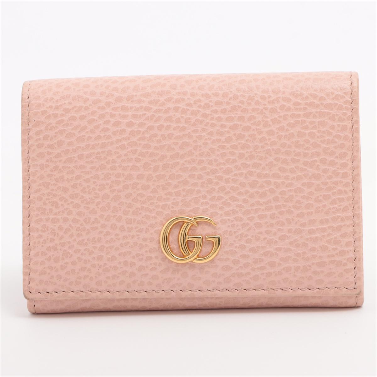 The Gucci GG Marmont Leather Card Case in Pink is a stylish and practical accessory that exudes luxury and sophistication. Crafted from high-quality leather, the card case features Gucci's iconic GG Marmont quilted pattern, showcasing the brand's