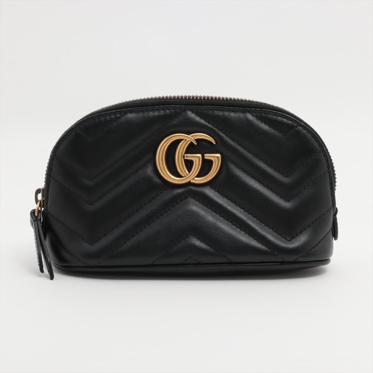 The Gucci GG Marmont Chevron Leather Pouch in Black is a sleek and elegant accessory that showcases the luxury and craftsmanship of the Gucci brand. Made from supple black leather, the pouch features a striking chevron pattern that adds a touch of