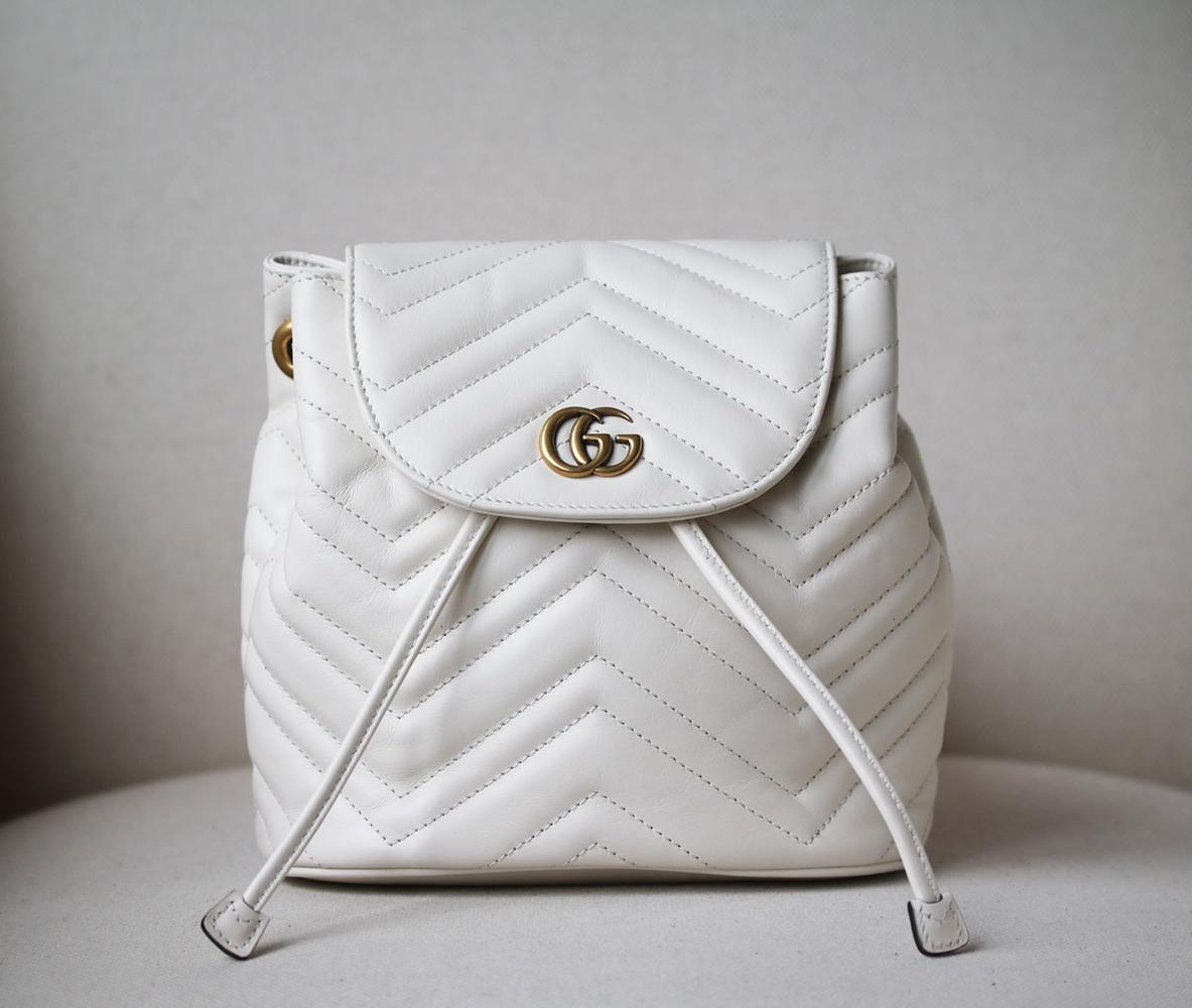 It's been made in Italy from leather quilted in a classic chevron pattern, and finished with the brand's archival burnished 'GG' hardware at the front flap. Fasten it with the drawstring closure to secure essentials. White leather (Calf).