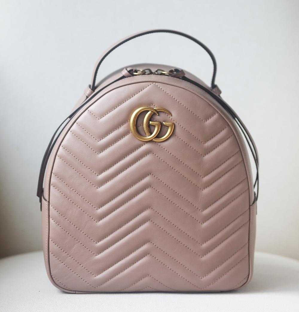 Beautifully made in Italy from quilted leather, this softly structured style is adorned with a burnished 'GG' plaque and fastens with exaggerated zip pulls.
It has a top handle, two adjustable shoulder straps and internal pockets for your cards,