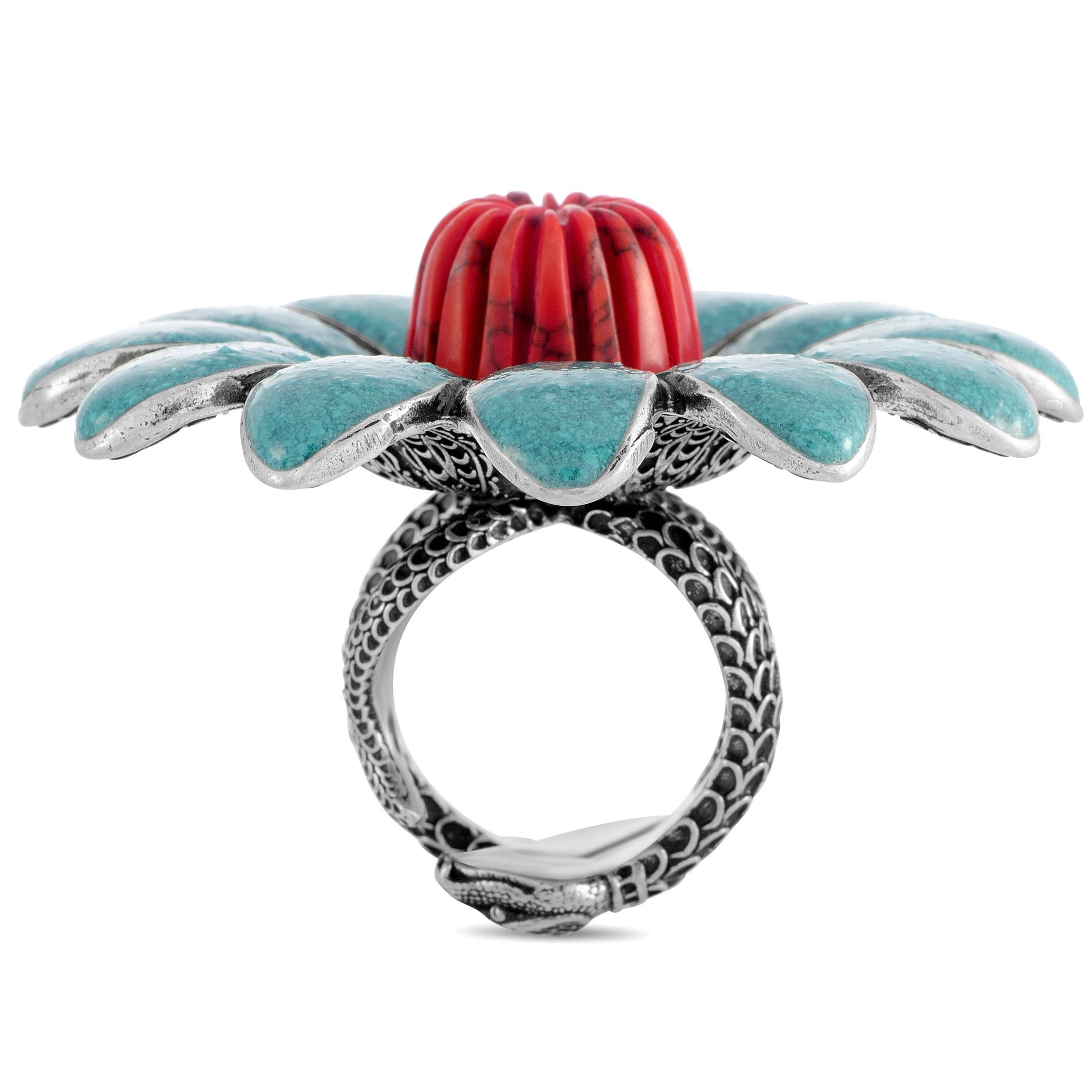 The Gucci “GG Marmont” ring is made out of sterling silver, turquoise enamel and coral resin. The ring weighs 44.1 grams, boasting band thickness of 11 mm and top height of 16 mm, while top dimensions measure 50 by 50 mm.
 
 This jewelry piece is