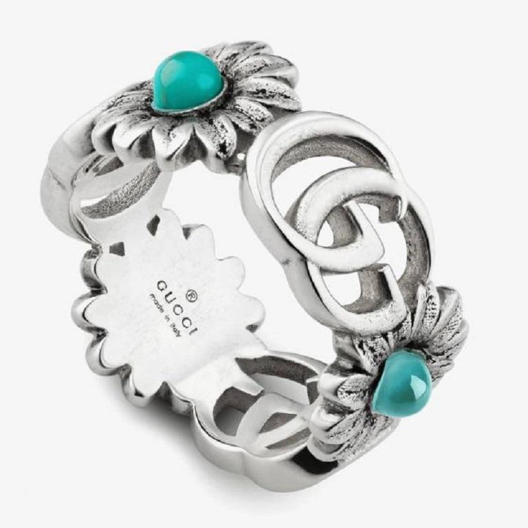 This floral-motif ring from Gucci's GG Marmont collection combines a bit of business with a bit of pleasure. Crafted in sterling silver, it features alternating elements of the brand's Double G logo, along with a daisy. The center of the flower gets
