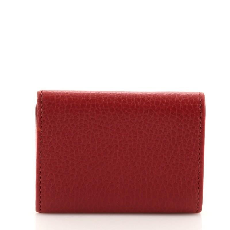 red rolex wallet