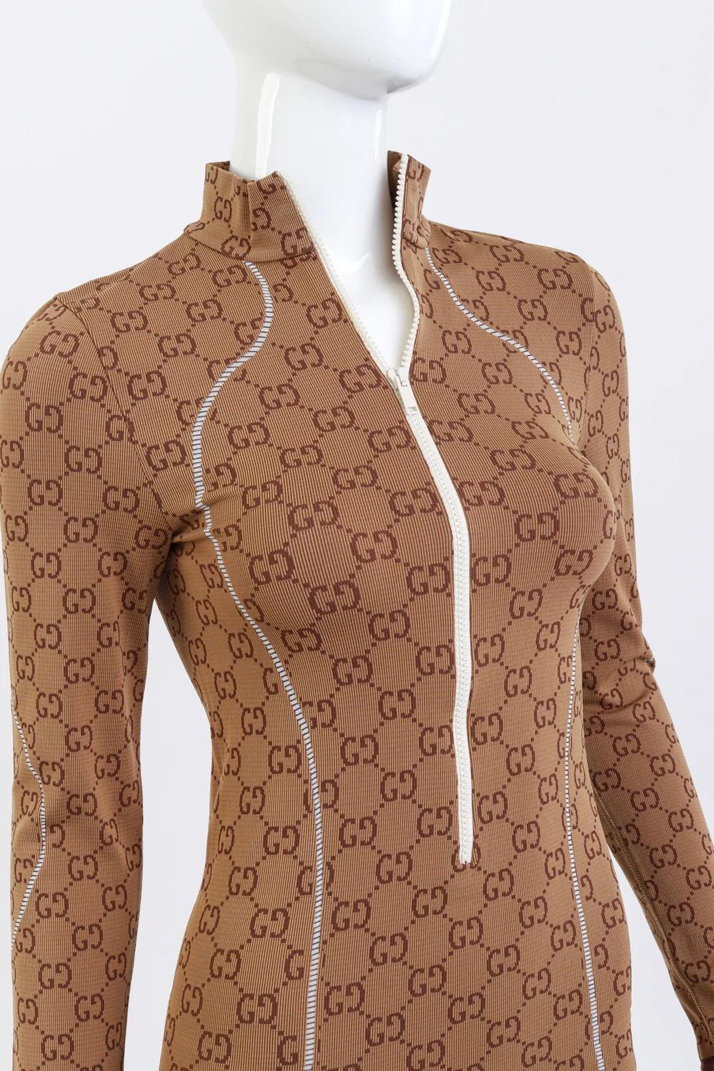 GUCCI GG MONOGRAM BROWN JACQUARD STRETCH SLIM MIDI DRESS (XS)

This Gucci midi dress is designed with a figure-hugging silhouette, featuring the signature GG monogram woven throughout in shades of sand, beige, and brown. Constructed from a stretch