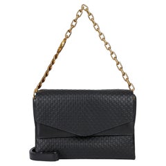 Gucci GG Monogram Embossed Shoulder Bag — Black