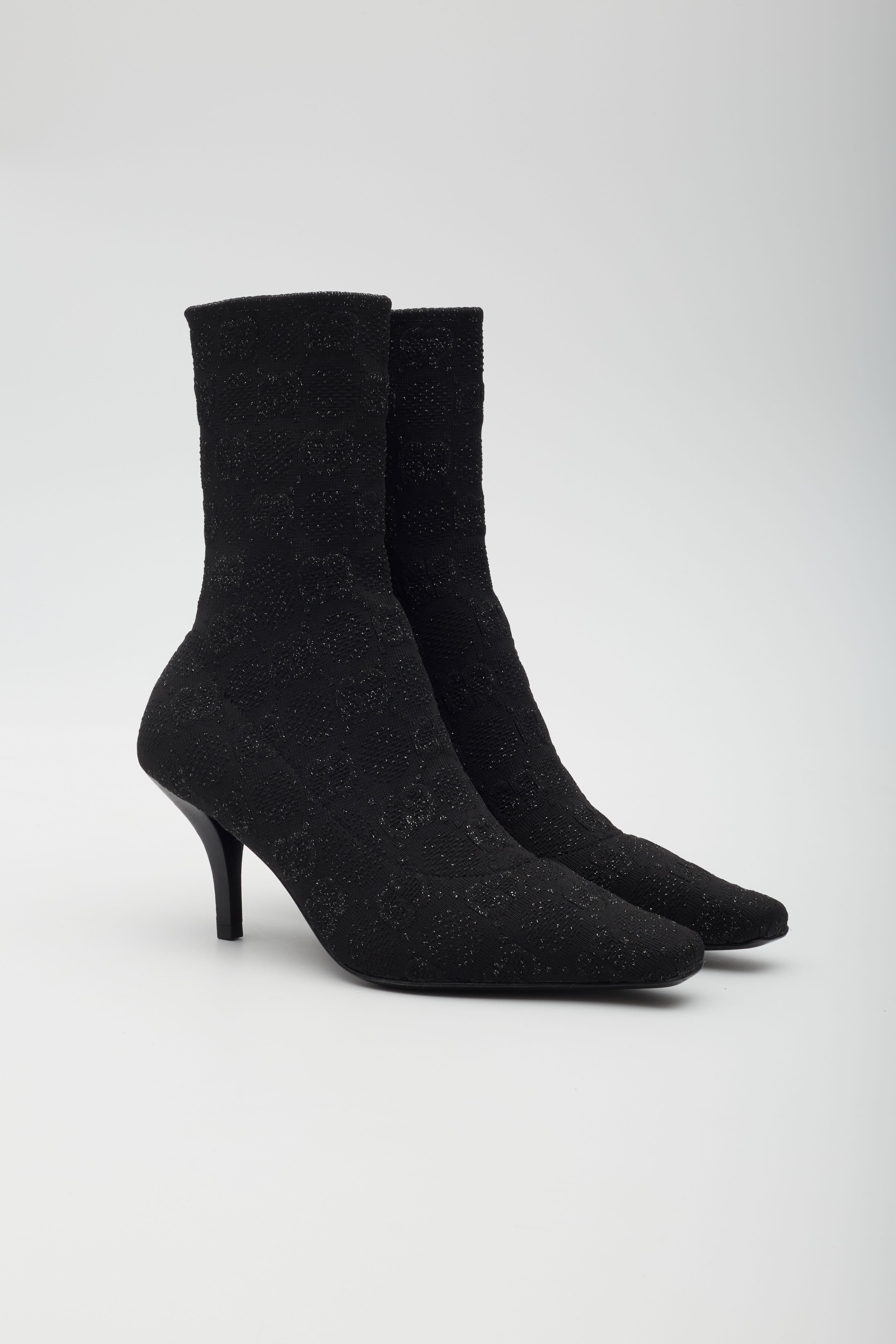 Color: black
Material: canvas with GG monogram knit jacquard

EU 41
Heel Height: 75mm / 3”
Height of rise: 6”
Condition: Excellent.
Comes with: Dust bag

Made in Italy