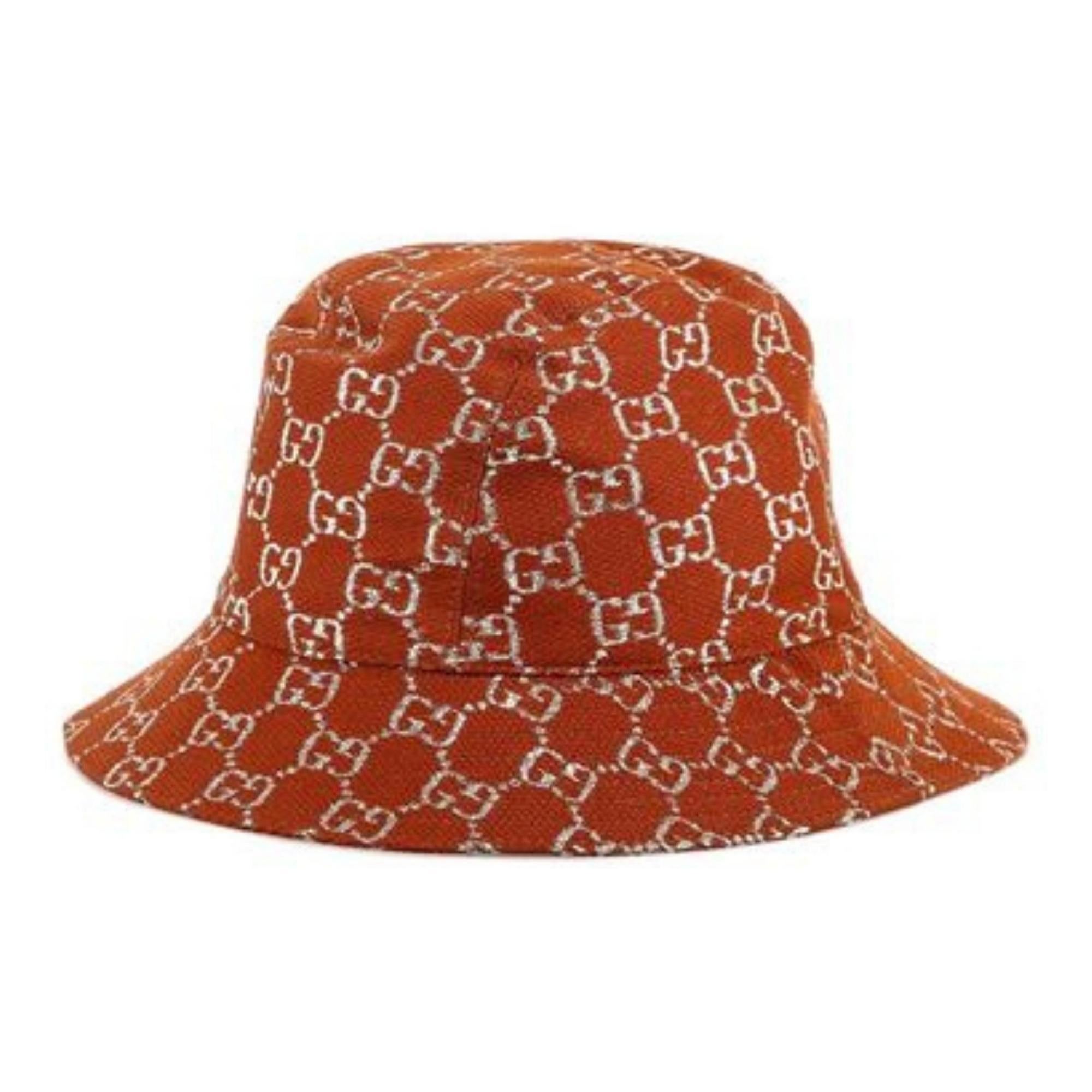 Brown/orange and silver-tone wool blend Gucci bucket hat with GG pattern and metallic accents throughout.

COLOR: Burnt Orange/Tan
MATERIAL: 71% Wool, 17% Polyamide, 12% Other Fibers
SIZE: Large 58 cm
ITEM CODE: 631951
COMES WITH: Tags
CONDITION: