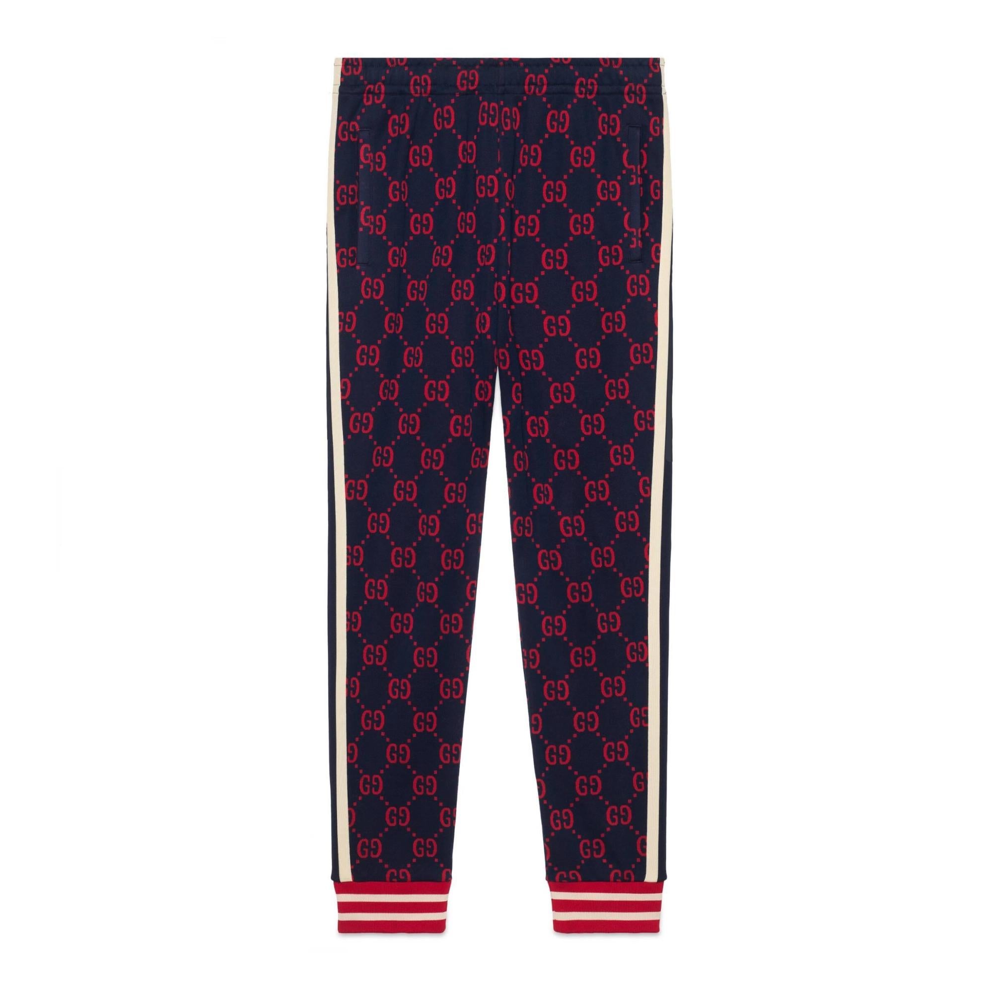 Gucci Navy sweatpants with monogram GG red jacquard. White and red cuff. Pants are in secondary location. May take 1-2 weeks to ship.

Color: Navy blue with red monogram jacquard
Material: Cotton
Code: 337506 Z5286
Condition: Good. Ask for more