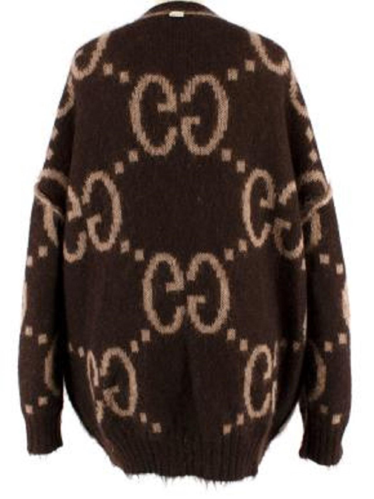 Gucci GG Monogram Reversible Mohair Cardigan

- Fuzzy mohair oversized knit cardigan with large GG monogram in light and dark brown
- Reversable with buttons on both sides 
- V-neckline with brown button closure
- Ribbed trims and 2 front pockets 
-