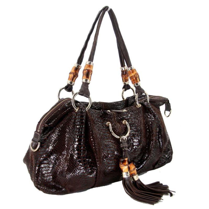 Gucci GG Python Embroider Bamboo with Tassels Leather Shoulder Bag

Coming from the house of Gucci, this Tassel Bamboo shoulder bag features the iconic Brown coated canvas with elegnat python style embroidery body and completed with leather trims.