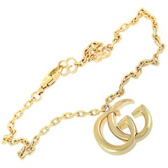 Gucci GG Running 18 Karat Yellow Gold Double G Charm Bracelet