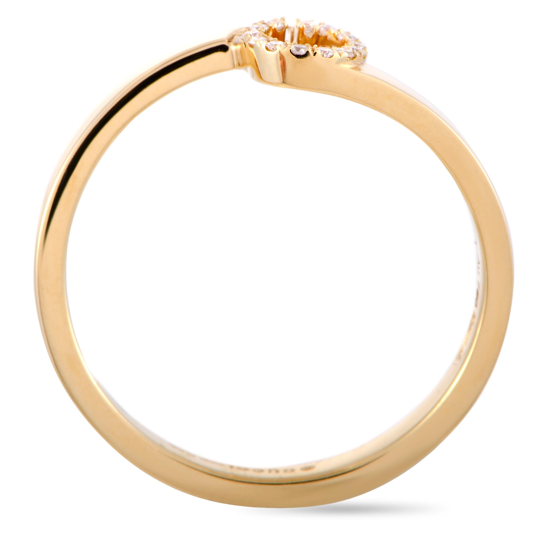The “GG Running” ring by Gucci is made out of 18K yellow gold and diamonds and weighs 2.5 grams. The diamonds feature GH color and VVS clarity and total approximately 0.05 carats. The ring boasts band thickness of 2 mm and top height of 2 mm, while