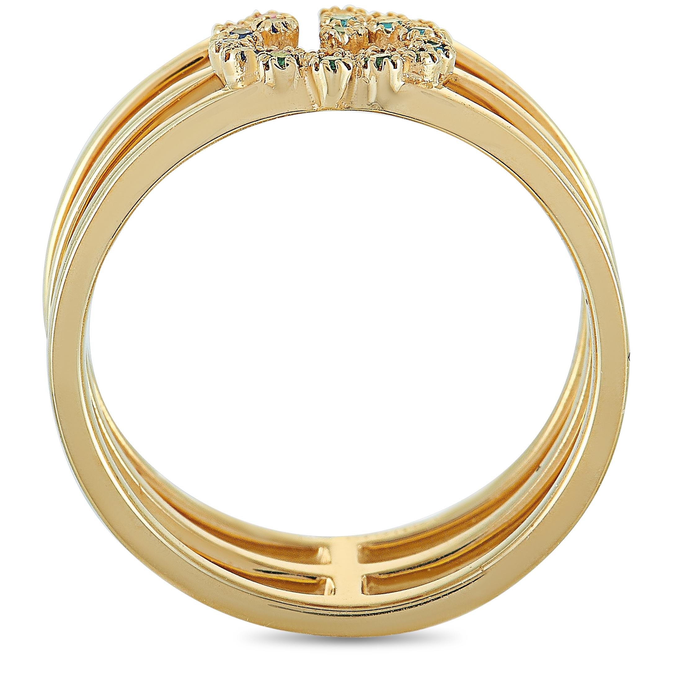 The “GG Running” ring by Gucci is crafted from 18K yellow gold and set with sapphire and tsavorite stones. The ring weighs 5.3 grams, and boasts band thickness of 10 mm and top height of 2 mm, while top dimensions measure 8 by 11 mm.

This item is