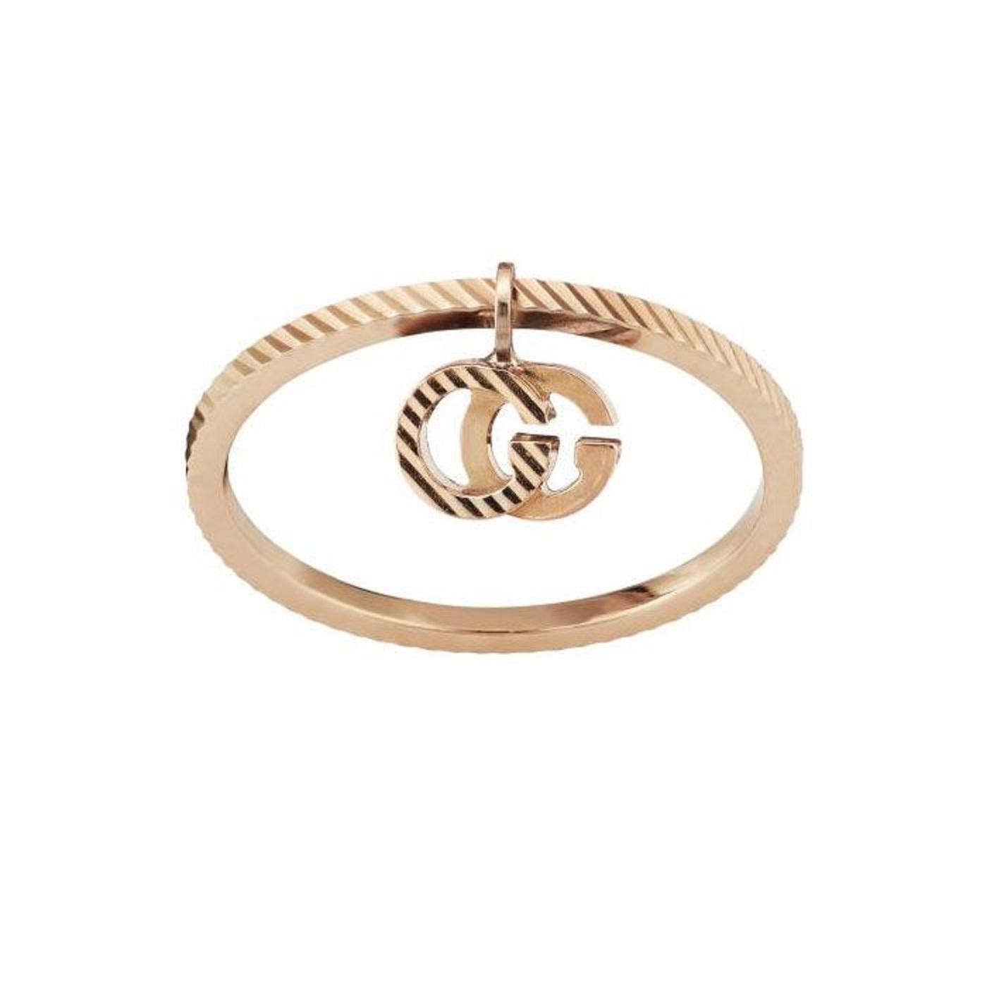 Signature GG Running styles, featuring the emblematic Double G, return as part of Gucci Love Parade, this time in a rose gold variation. The motif features here as a delicate pendant attached to this 18k ring of a classic design.

    18k rose gold
