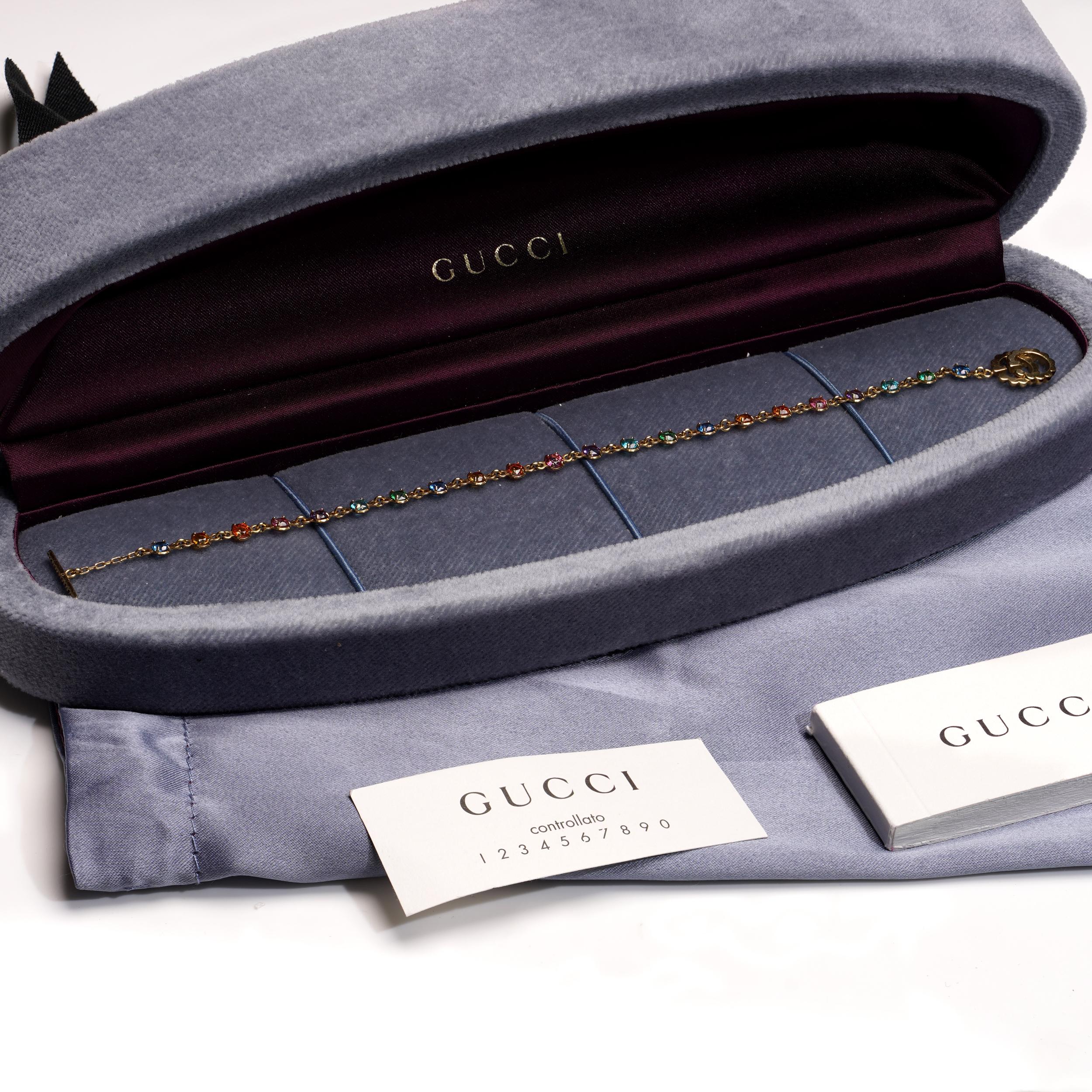 From Gucci’s iconic GG Running collection, this refined bracelet features an elegant line of bezel-set round-cut gemstones in a vibrant palette. The bracelet includes a tsavorite garnet (~0.10ct), topaz (~0.10ct), citrine quartz (~0.10ct), and an