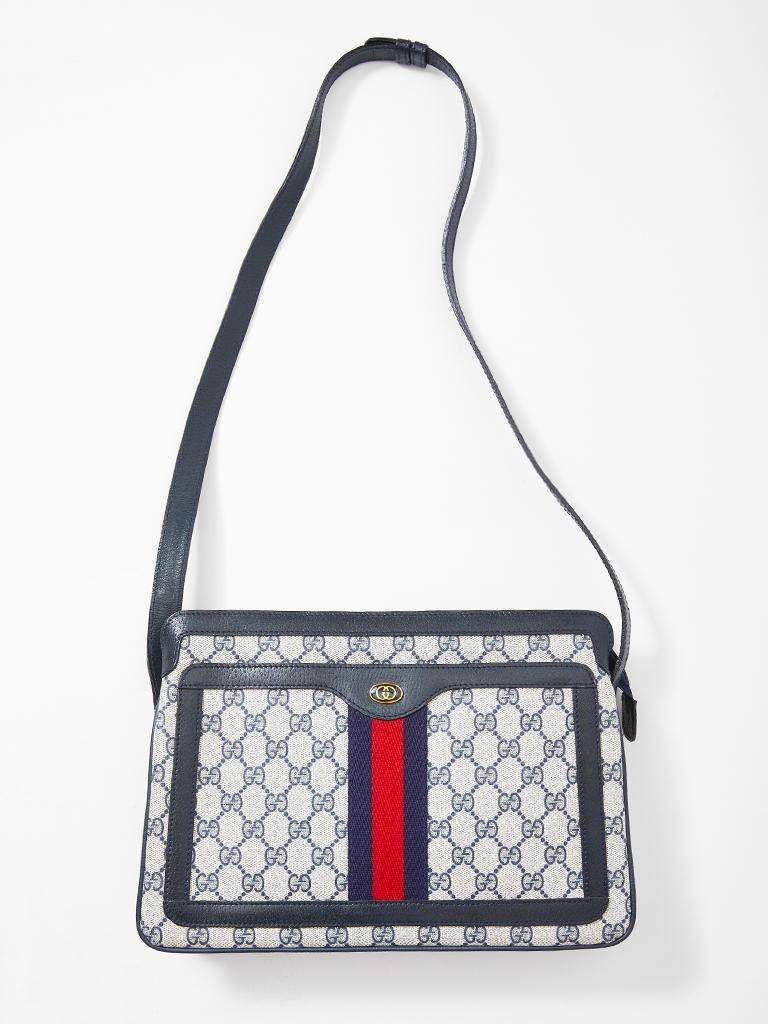 Gucci GG , coated canvas with navy leather trim shoulder bag. C. 1980's.