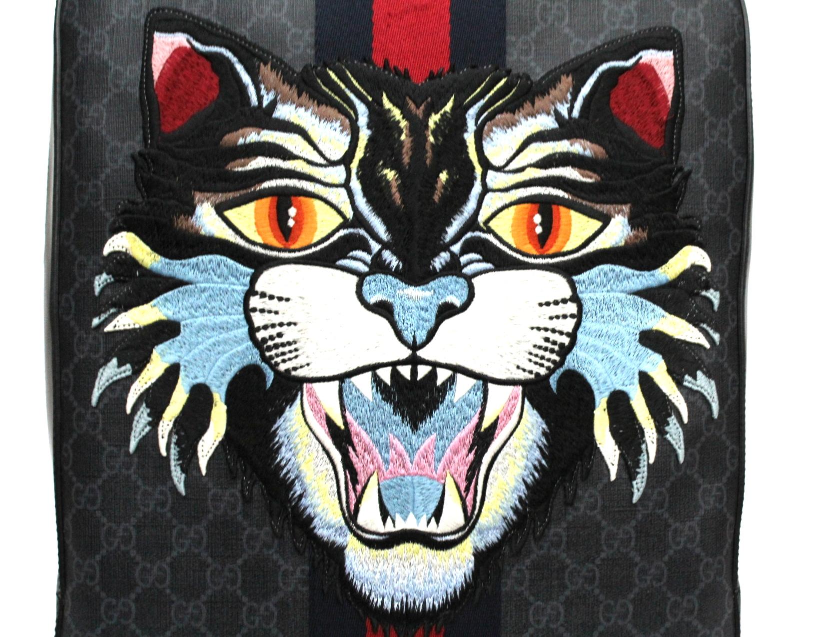 The snarling cat head is embroidered and applied to a structured backpack made in GG Supreme canvas with Web stripe.
Black/grey GG Supreme canvas, a material with low environmental impact, with black leather trim
Palladium-toned hardware
Blue and