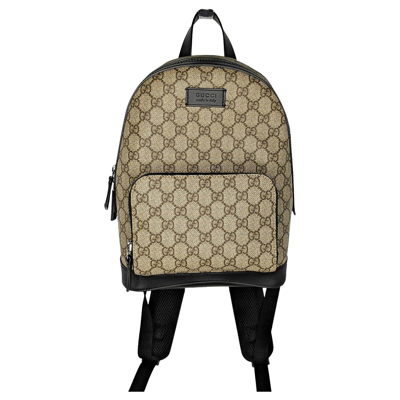 Shop the GG Supreme small backpack by Gucci. Small GG Supreme canvas  backpack, finished with black leather details.