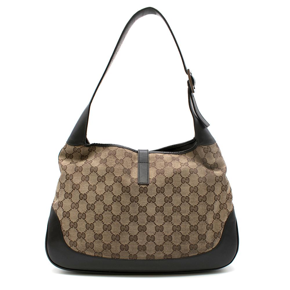 Gucci GG Supreme canvas hobo bag with interlocking Hardware

- Red/Green detailing 
- Silver interlocking hardware,
- Brown leather textured trim,
- Canvas lining,
- Dust bag included

Please note, these items are pre-owned and may show signs of