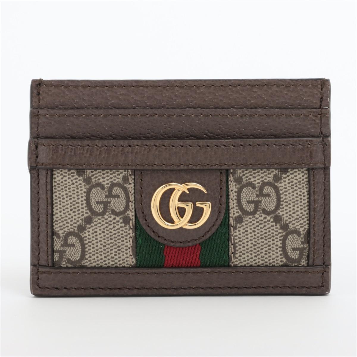 The Gucci GG Supreme Card Case in Brown is a sleek and stylish accessory that combines timeless elegance with modern flair. Crafted from the brand's iconic GG canvas, the card case features classic brown monogram pattern synonymous with Gucci's