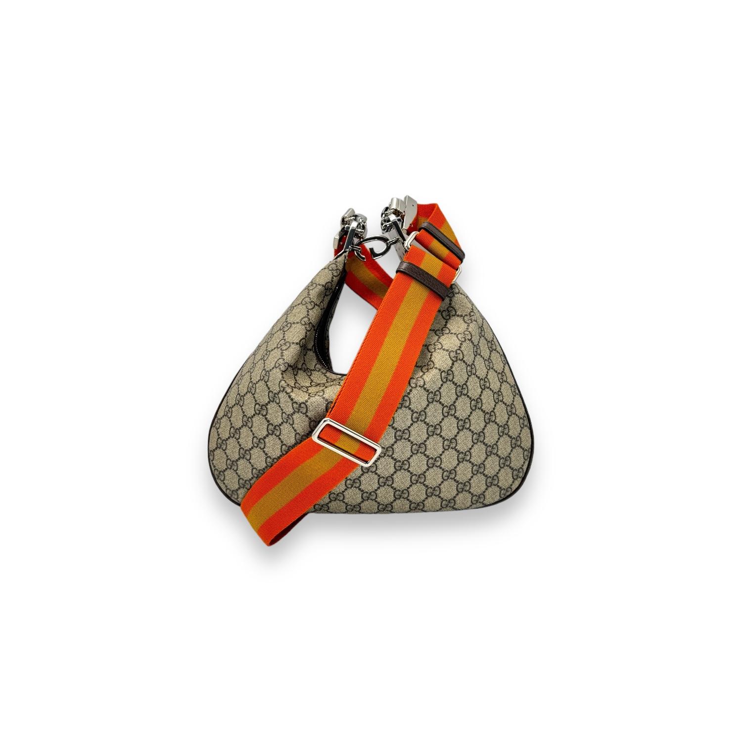 Embrace effortless style and functionality with the Gucci GG Supreme Large Hobo Crossbody Bag. Expertly crafted in Italy with durable GG Coated Canvas, this designer bag features a spacious interior with a single zip compartment for your essentials.