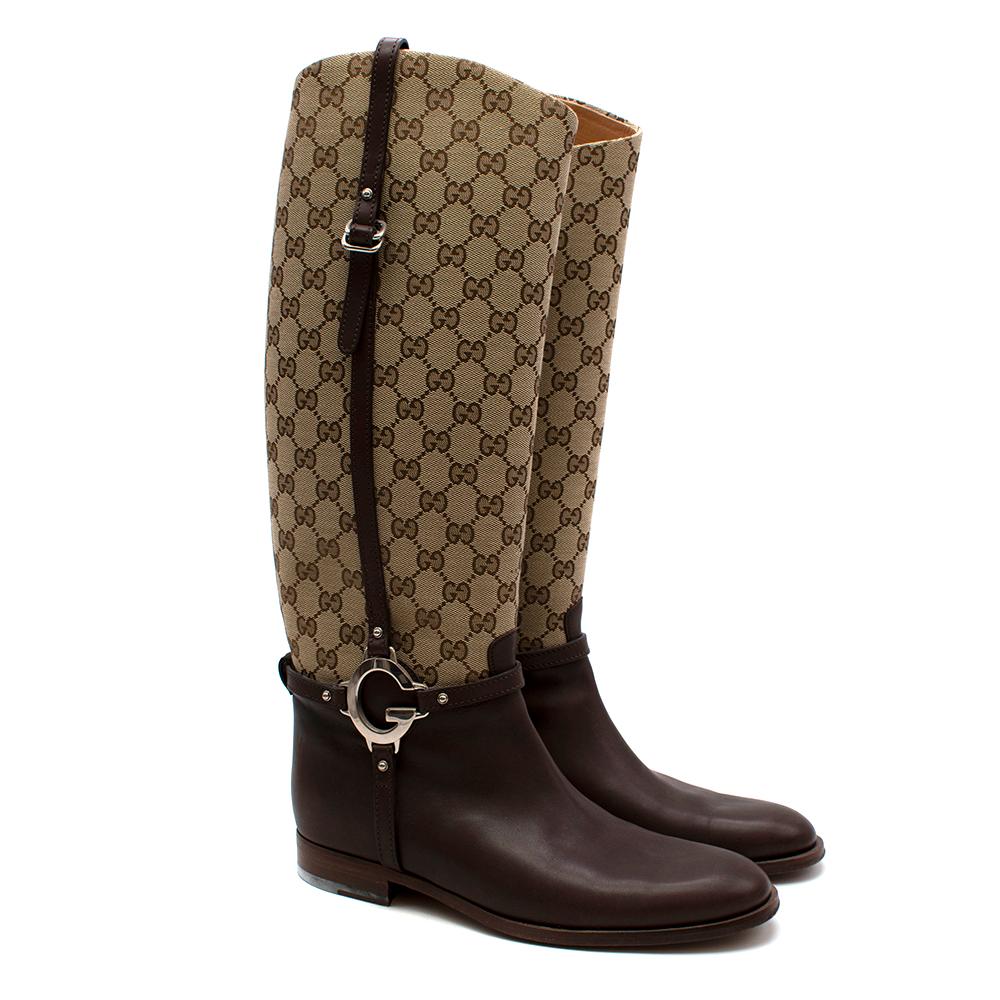 Gucci GG Supreme Leather Knee High Boots

- Gucci GG Supreme logo boots
- Knee length
- Brown leather toe with canvas leg
- Leather buckle detailing 
- 'G' silver metal hardware buckle emblem 
- Leather sole and inner lining 
- Pull on style 
- EU