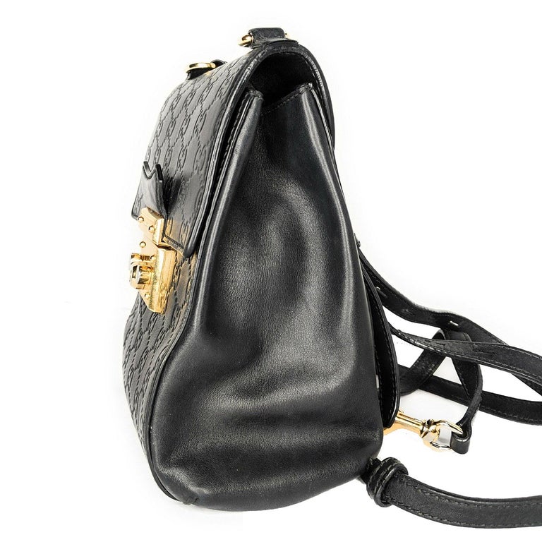 Shop Gucci's Padlock GG Supreme Mini Backpack