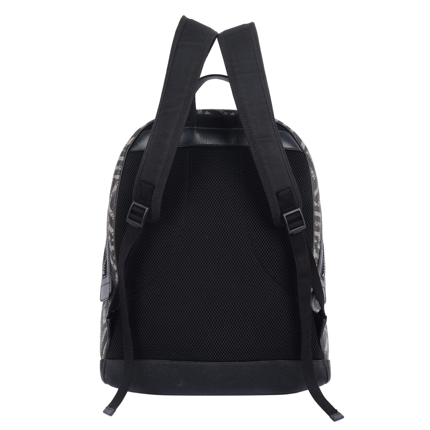 Authentic, pre-loved Gucci GG Supreme Monogram Caleido Backpack in Black. This stylish backpack features Gucci GG monogram coated canvas, front zipper pocket, leather top handle, nylon padded shoulder straps, large brown microfiber interior with