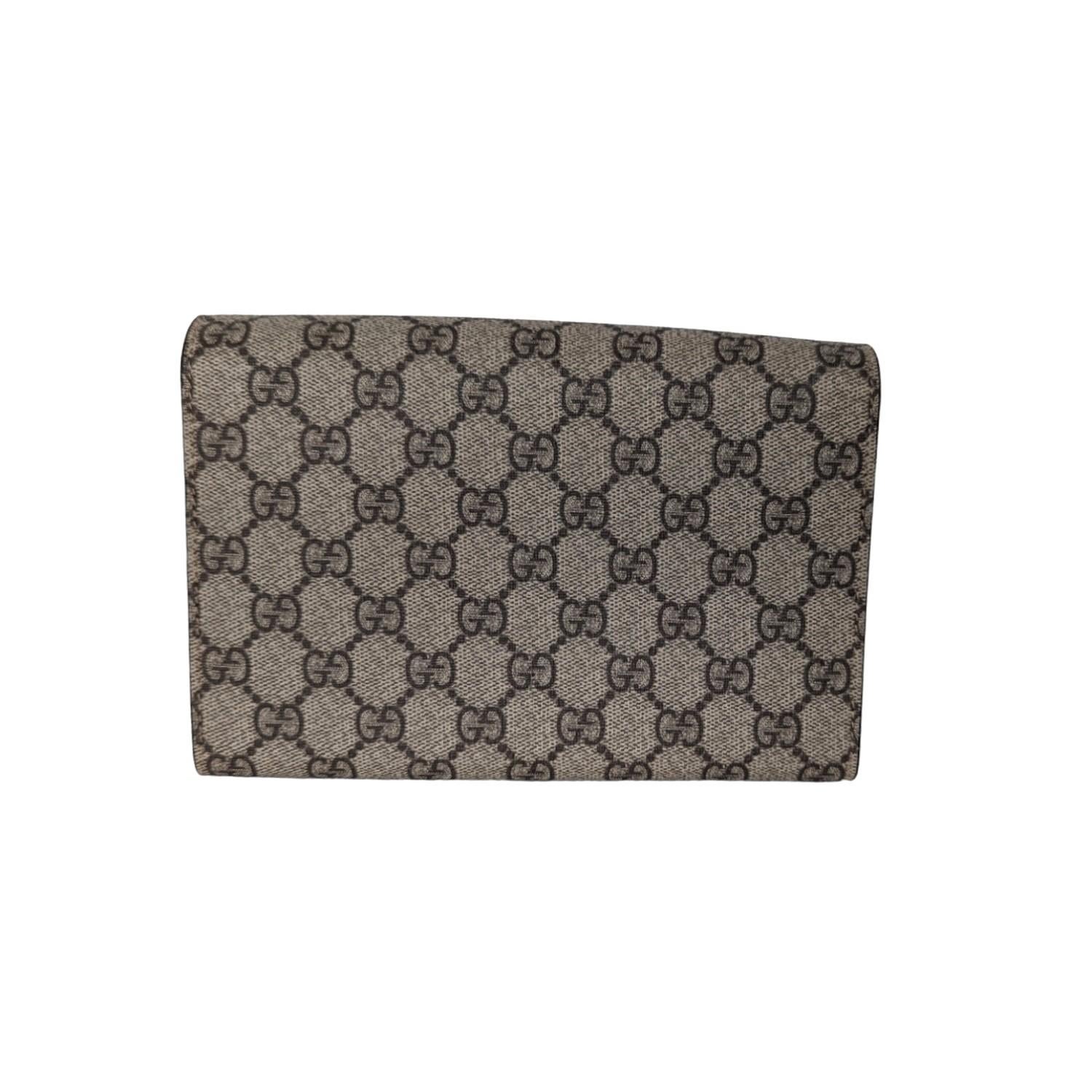 This stylish bag is crafted of Gucci GG monogram coated canvas. This bag features a removable antiqued silver chain shoulder strap and a textured horseshoe closure with lion heads at the end. This opens to a leather interior for a sophisticated look