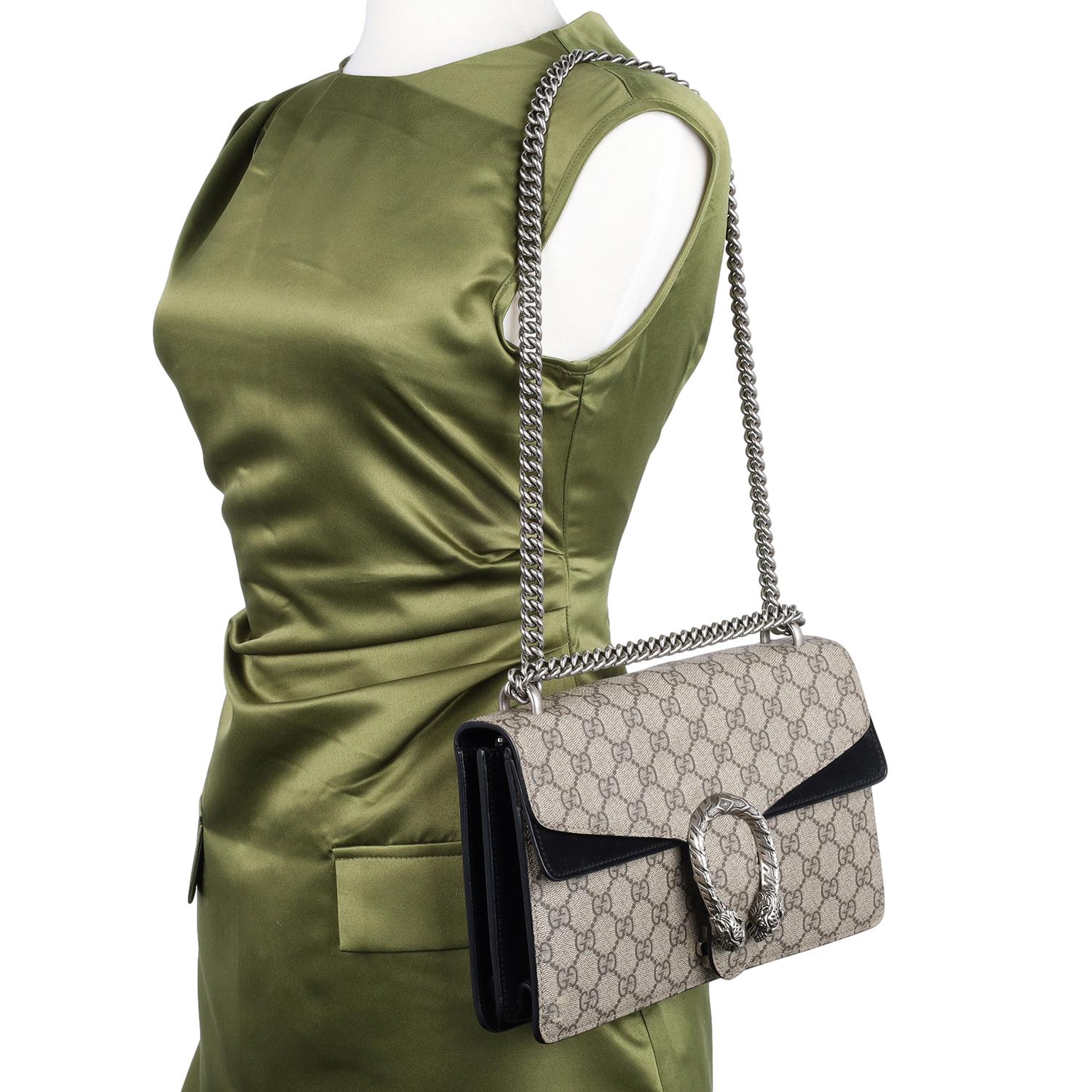 Authentic, pre-owned Gucci GG Supreme Monogram Medium Dionysus Shoulder Bag in Black. Features Gucci GG monogram canvas, slip pocket under the flap closure, large doubled interior with middle zipper pocket, front horseshoe closure, silver chain