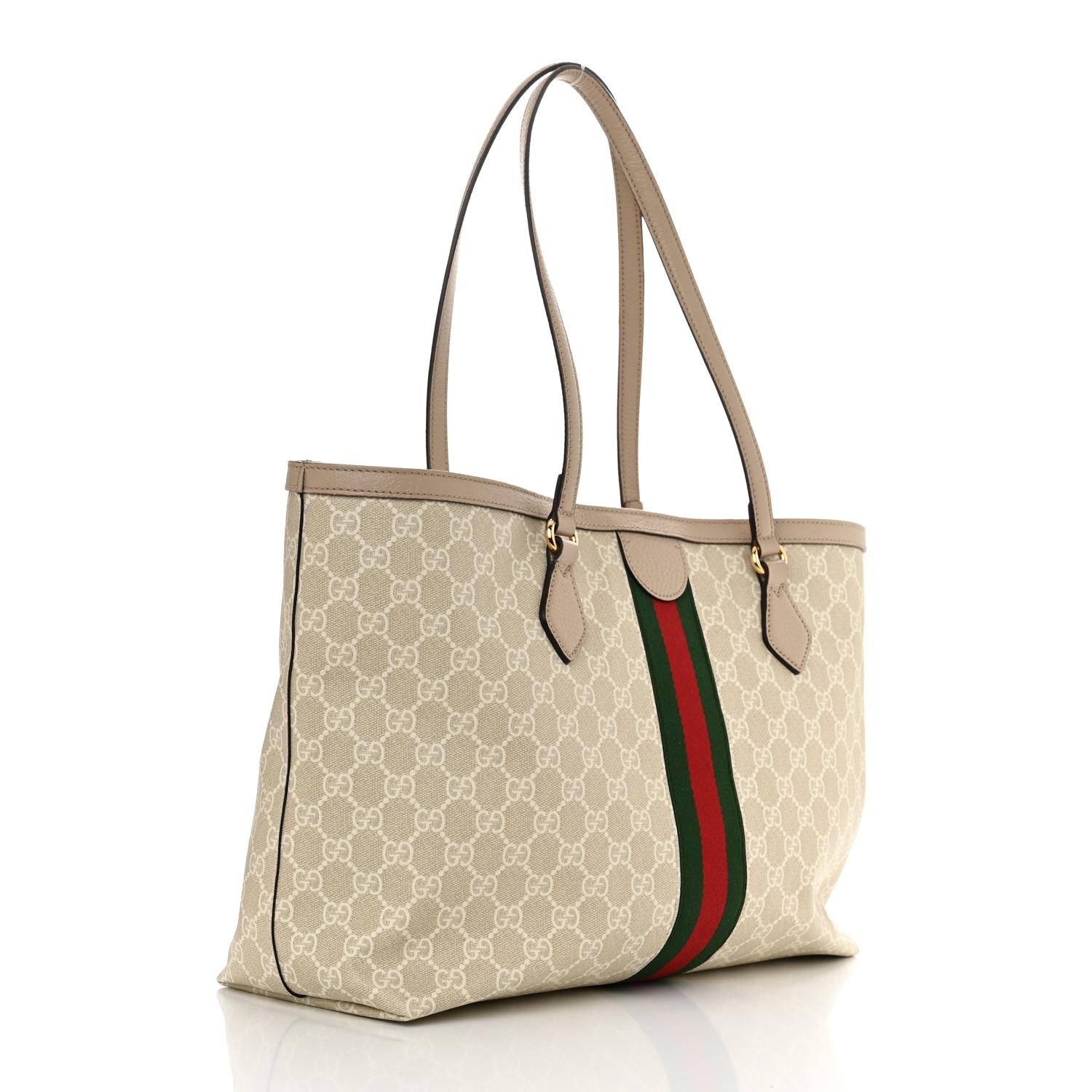 This tote is made of Gucci GG supreme monogram coated canvas with a green and red web stripe detail. The handbag features top leather strap handles with an open top that leads to a beige fabric interior with zipper and patch pockets.

Color: