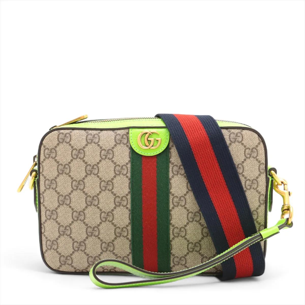 La borsa a tracolla Gucci GG Supreme Ophidia in pelle beige e verde neon è un'audace reinterpretazione di un design classico. Realizzata in tela GG Supreme con accenti in pelle liscia, presenta il caratteristico dettaglio della striscia Web e
