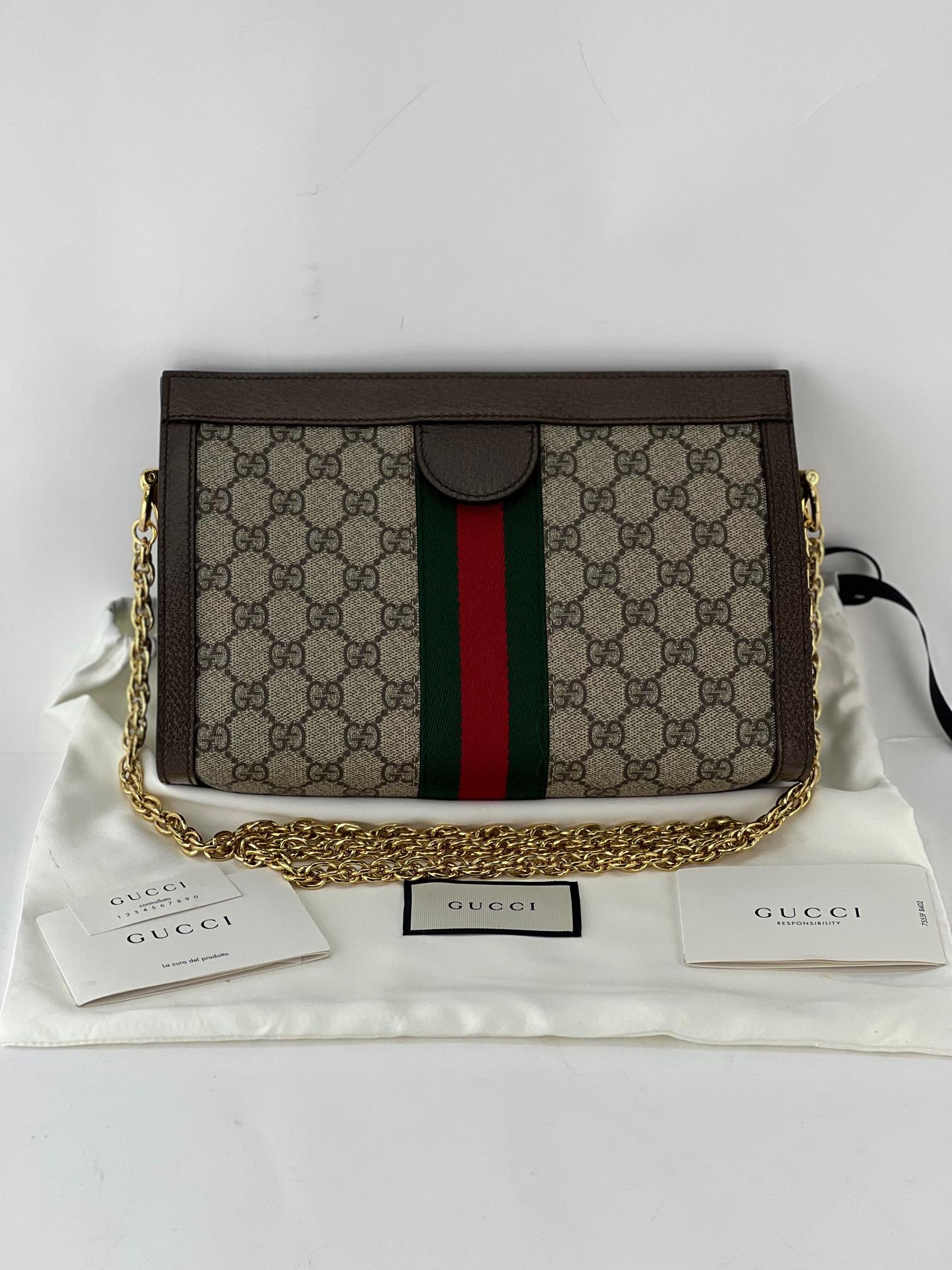 Pre-Owned  100% Authentic
Gucci GG Supreme Ophidia Small Monogram Web
RATING: A..Excellent, near mint, only slight
sign of wear
MATERIAL: Gg supreme monogram canvas, leather
CLOSURE: 4 magnetic tabs
HANDLE: golden attached strap, can
put inside bag